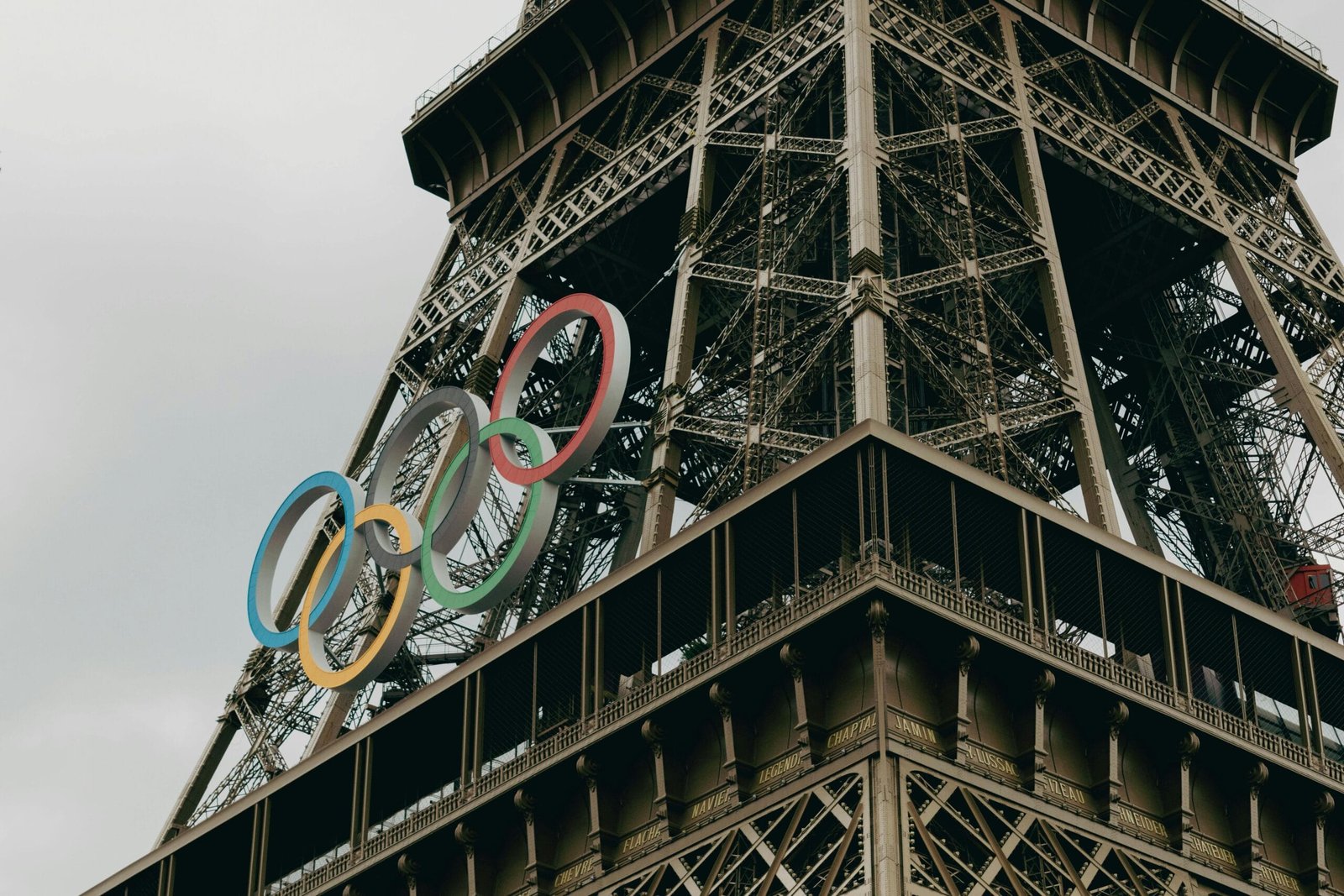 Close-up of the Eiffel Tower adorned with Olympic rings in Paris.