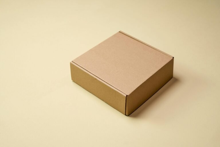 Simple cardboard box displayed on a neutral surface, ideal for product packaging visuals.